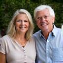 Portrait of a smiling couple, Mark and Jessica Thompson, enjoying their outdoor space.